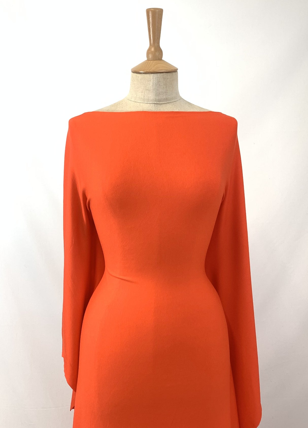 Spongle Orange Knitted Bright Viscose Lycra Jersey Fabric Manequin Close Up Dress Fabric Photo