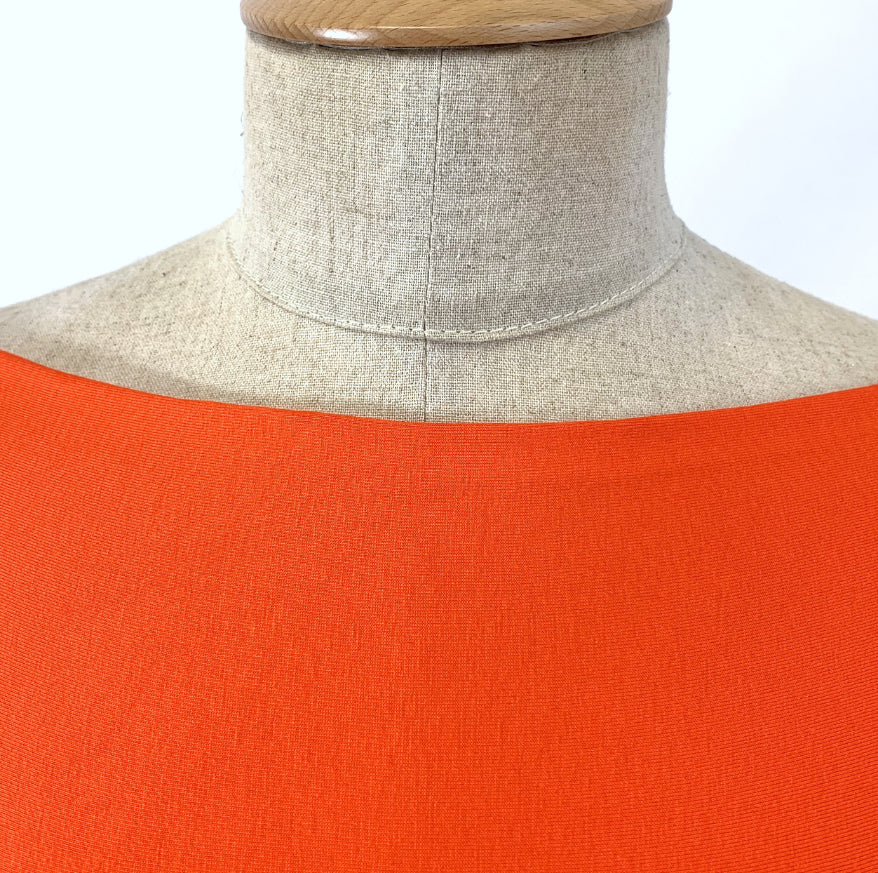 Spongle Orange Knitted Bright Viscose Lycra Jersey Fabric Manequin Close Up Fabric Photo