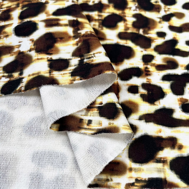 Stof cotton jersey leona leopard print yellow brown oeko tex elastane knitted dress fabric fold