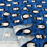 Stof cotton jersey pablo penguin print blue oeko tex elastane knitted fabric fold