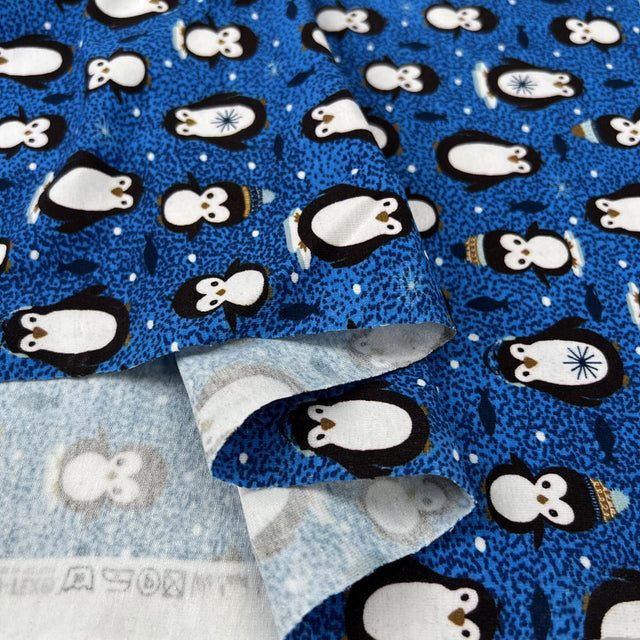 Stof cotton jersey pablo penguin print blue oeko tex elastane knitted fabric fold