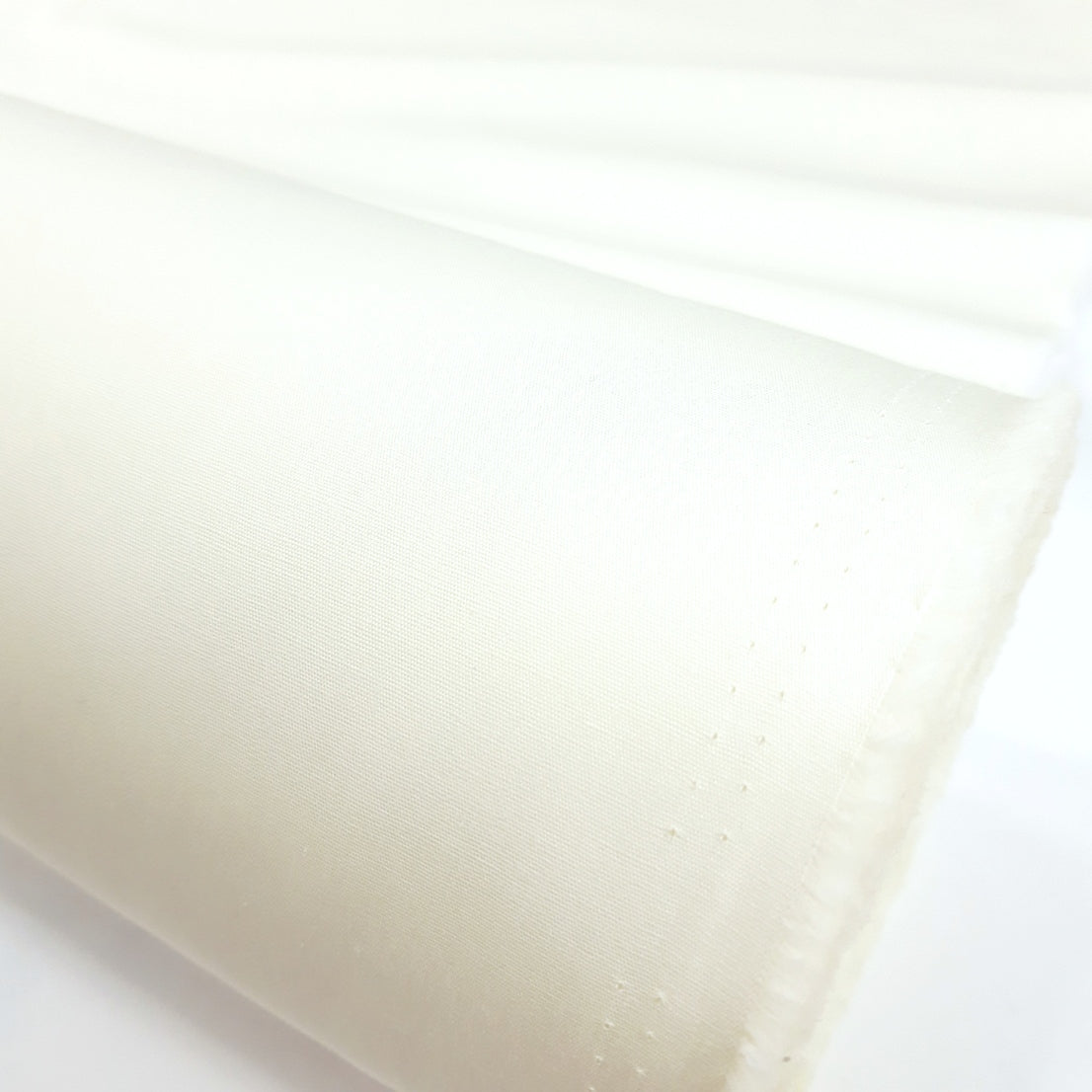 Superior Quality Ivory Plain Cotton Poplin Close Up Fabric Photo