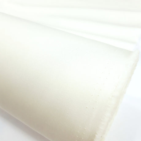 Superior Quality Ivory Plain Cotton Poplin Close Up Fabric Photo