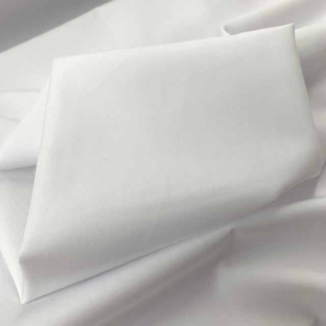 Superior Quality Poly Cotton Poplin White Plain Dyed Poly Cotton Poplin Shirting Fabric Close Up Drape Fabric Photo