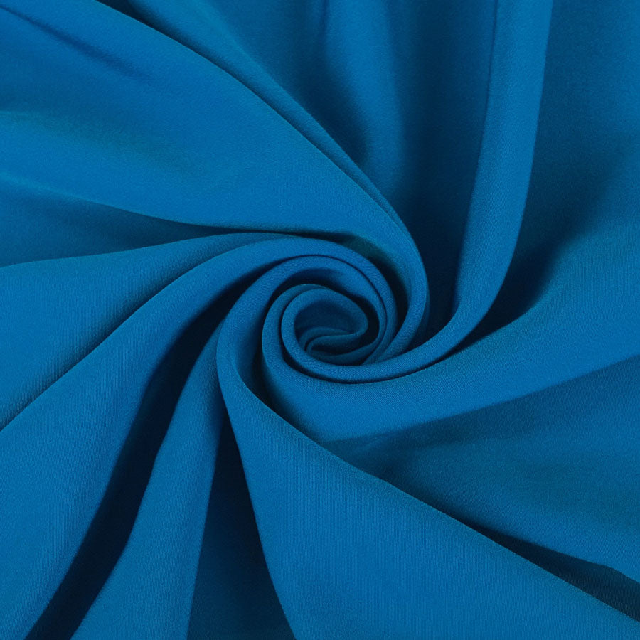 Superior Satin Crepe Peacock Deep Blue Polyester Crepe Dress Fabric Close Up Drape Fabric Photo