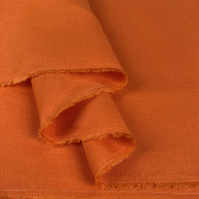 Tangerine Glow Orange Linen Ex Designer Plain Woven Dress Fabric Fold
