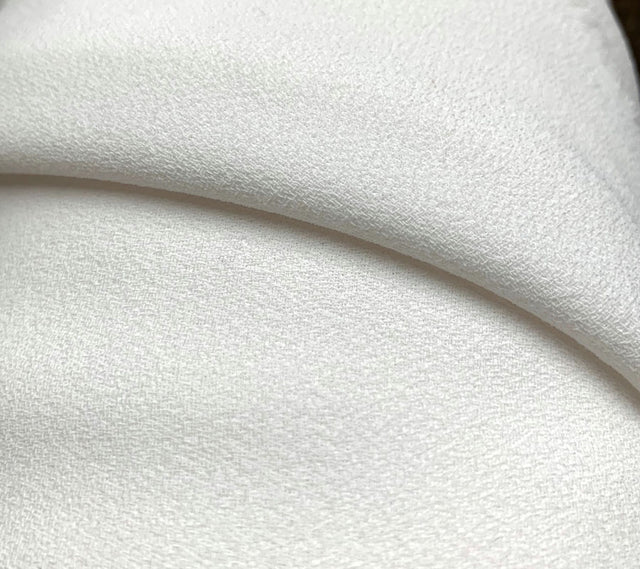 Triple Crepe Ivory Pale Natural Ivory Polyester Triple Heavyweight Crepe Close Up Drape Fabric Photo