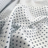 White polyester dress fabric navy diamonds oh so s