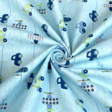 Winceyette The Big Race Cars Pale Blue Brushed Cotton Shirting Fabric Close Up Drape Fabric Photo